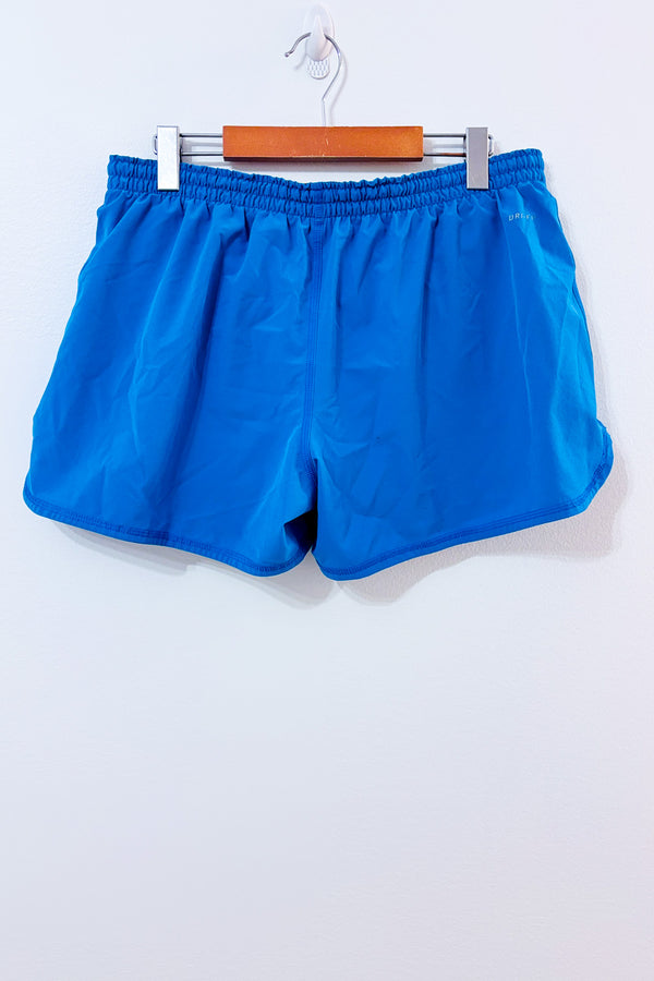 Short Dri-Fit bleu avec short intégré seconde main - Nike- La Penderie du Paradis