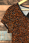 Robe noire avec motifs orangé (xs/s) seconde main San Francisco 